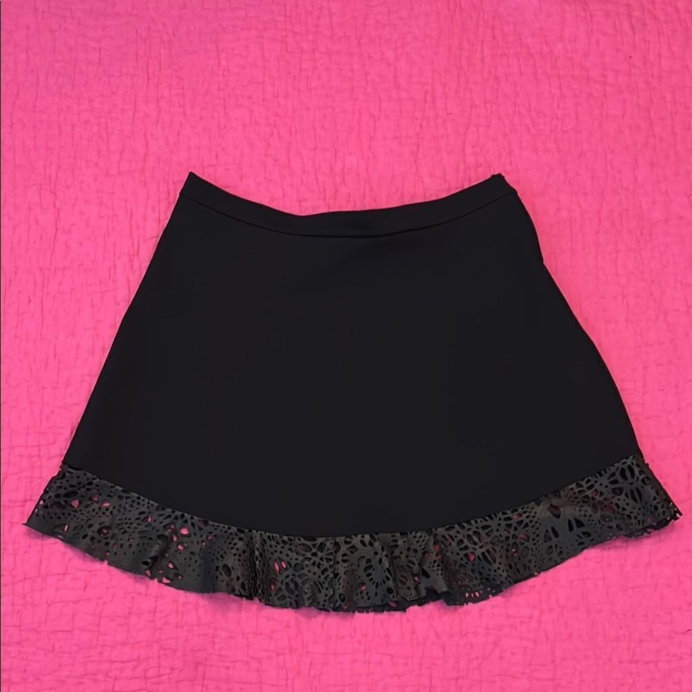 Jazmin Chebar black mini skirt with genuine leather laser cut trim, L